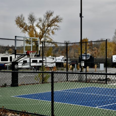 Picturesque outdoor recreational areas within the resort, such as walking trails, picnic spots, and playgrounds at Riverside RV Luxury Resort in South Weber, Utah.