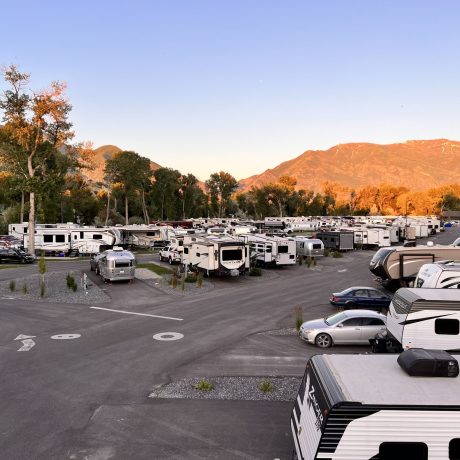 Upgraded premium RV sites with outdoor dining, seating, and propane fire grills for the ultimate camping experience at Riverside RV Luxury Resort in South Weber, Utah.