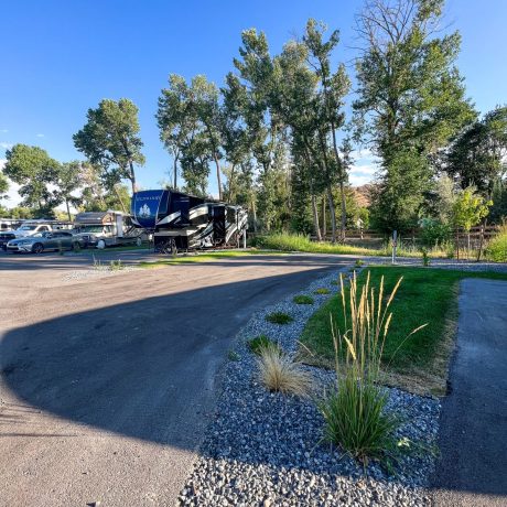 Upgraded premium RV sites with outdoor dining, seating, and propane fire grills for the ultimate camping experience at Riverside RV Luxury Resort in South Weber, Utah.