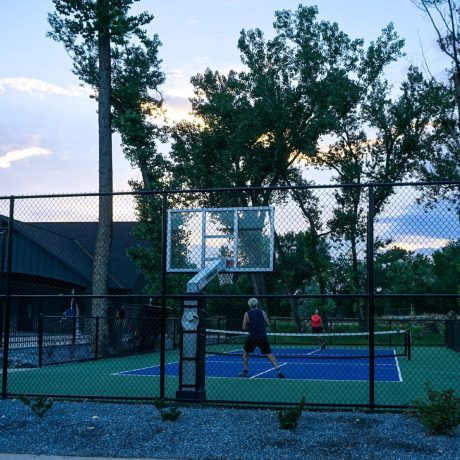 Picturesque outdoor recreational areas within the resort, such as walking trails, picnic spots, and playgrounds at Riverside RV Luxury Resort in South Weber, Utah.